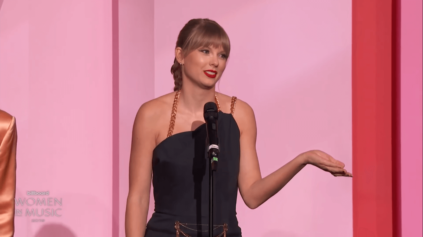 Taylor Swift accepts the Woman of the Decade award from Billboard