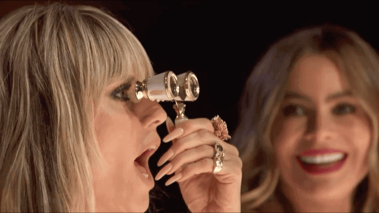 Howie Mandel gives Heidi Klum binoculars