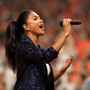 Nicole Scherzinger performs the National Anthem at a Baseball Game