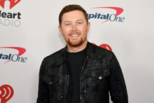 Watch Garth Brooks Invite Scotty McCreery to Join the Grand Ole Opry