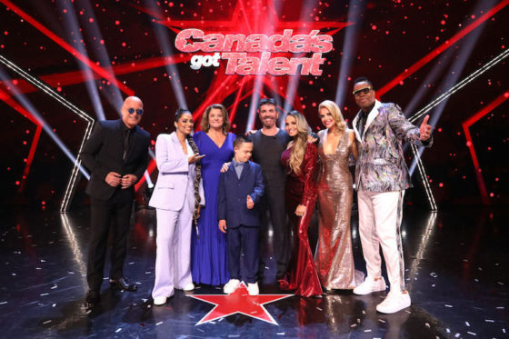 Howie Mandel, Lilly Singh, 2022 winner Jeanick Fournier, Simon Cowell, Trish Stratus, Lindsay Ell, and Kardinal Offishall celebrate during the 