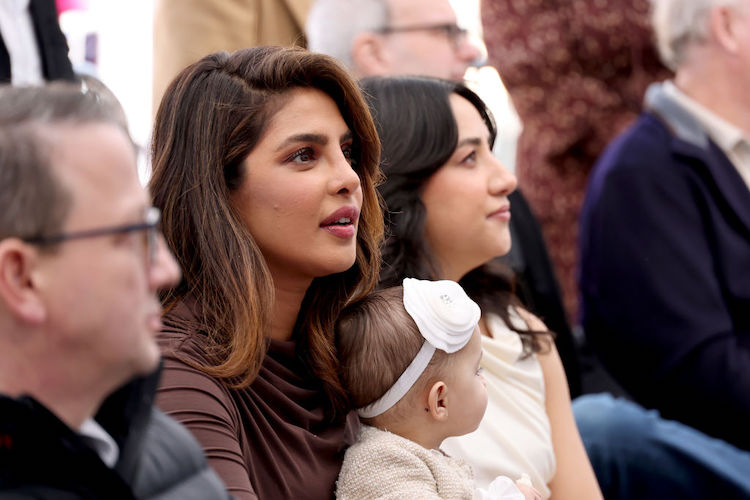 Priyanka Chopra with her child at the Hollywood Walk of Fame Ceremony for The Jonas Brothers