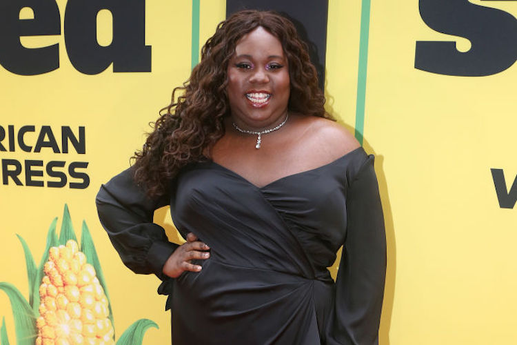 Alex Newell on the Shucked red carpet