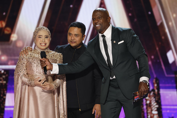Putri Ariani on the 'America's Got Talent' stage with Terry Crews 